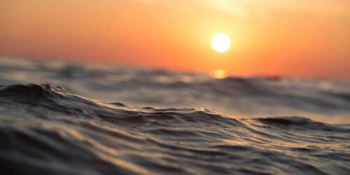 body of water during golden hour